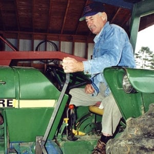 Man on a John Deere tractor 