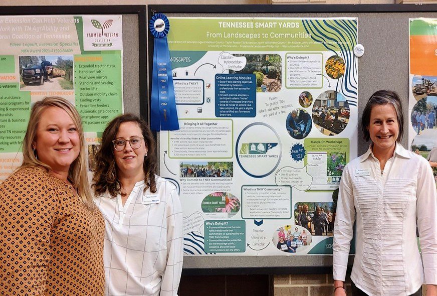 Dr. Andrea Ludwig, Celeste Scott, Madison County Extension Agent and Taylor Reeder, Williamson County Extension Agent with their ANR poster