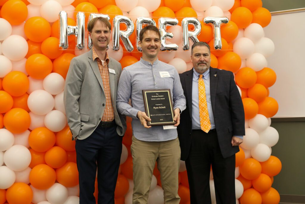 Ryan Armistead stands with Dr. Tom Gill and Dr. David White at the 2024 Herbert Awards Banquet