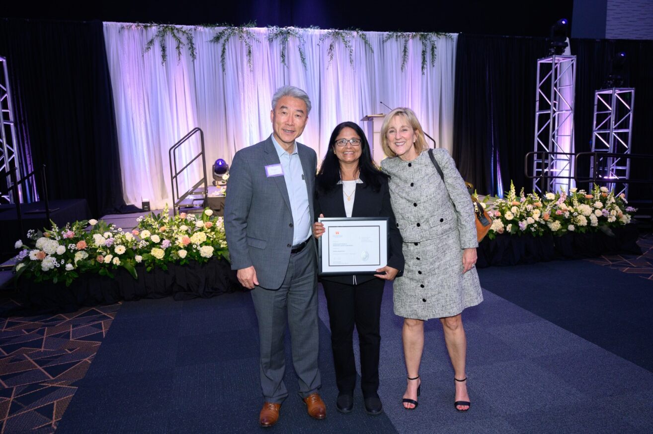 Dr. Sindhu Jagadammy receiving the Professional Promise in Research and Creative Achievement Award